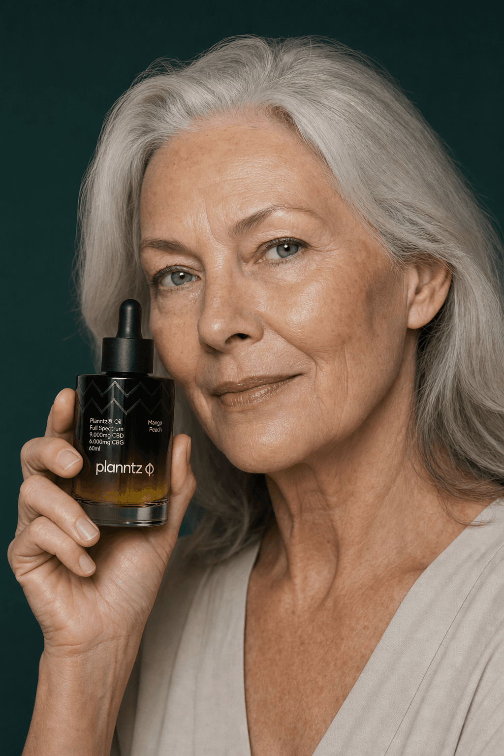 A woman holding a Planntz full-spectrum CBD + CBG tincture bottle to her face